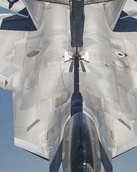 Image of a jet performing a mid air refuel